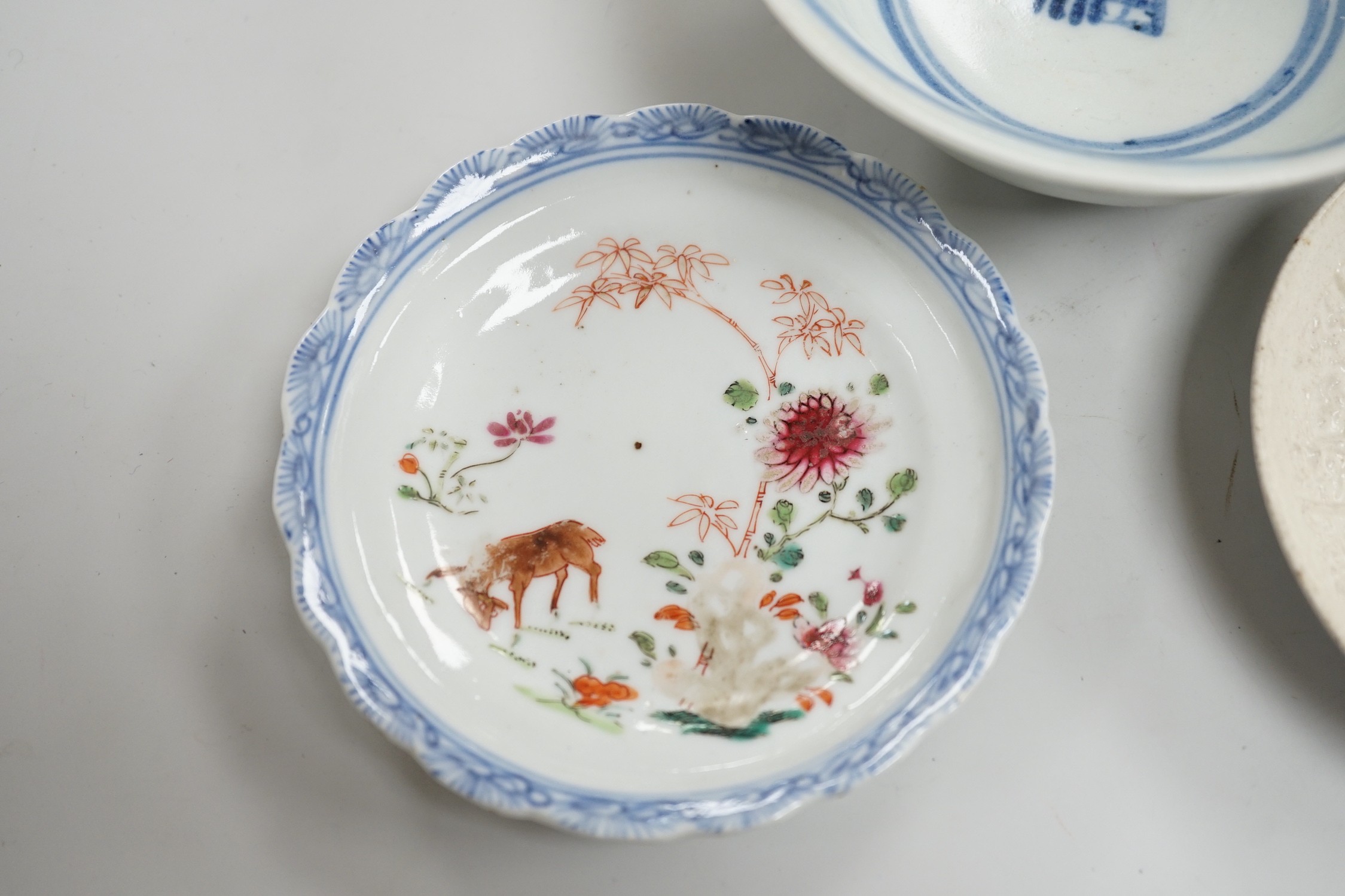 A small Chinese Ming blue and white bowl, and other, together with two small saucers (4)